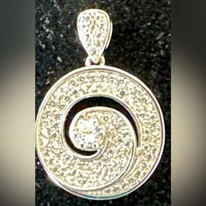 Pendant w/authentic White Sapphire swirl design set in 925 sterling silver guc